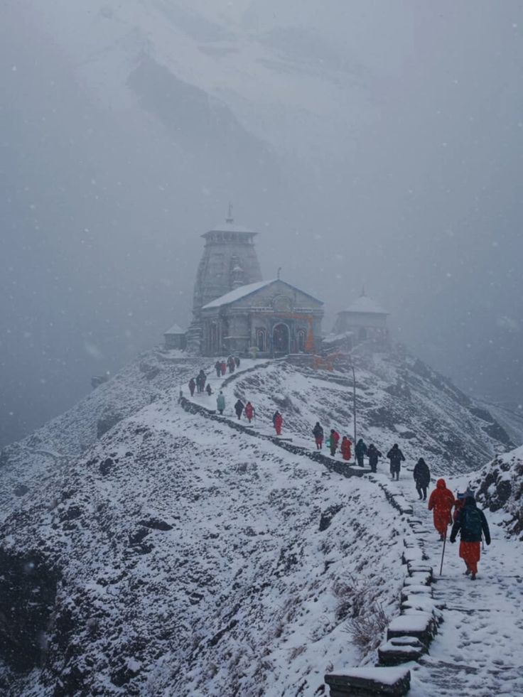 Travellers overlooking a Himalayan lake at sunrise